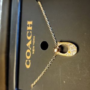 Gold coach necklace